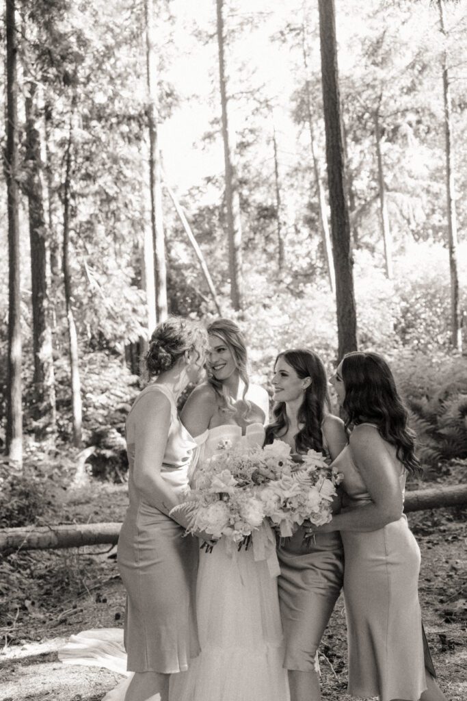 Bride and groom posing in a romantic forrest to capture elegant wedding photos.