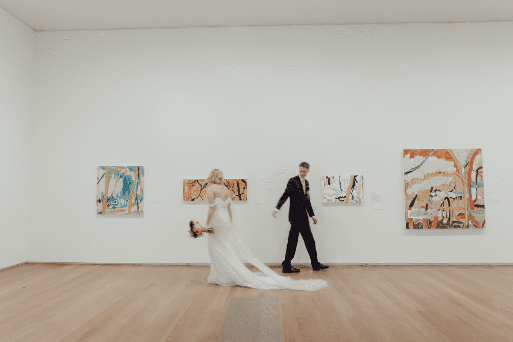 Contemporary wedding setup in the atrium at Remai Modern, Saskatoon, with modern art and panoramic river views