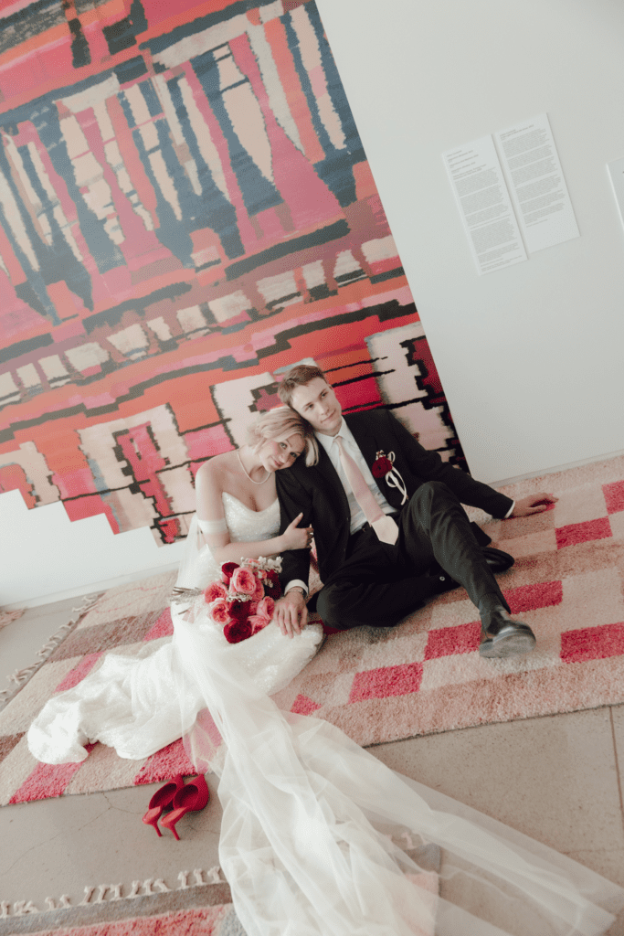 Contemporary wedding setup in the atrium at Remai Modern, Saskatoon, with modern art and panoramic river views