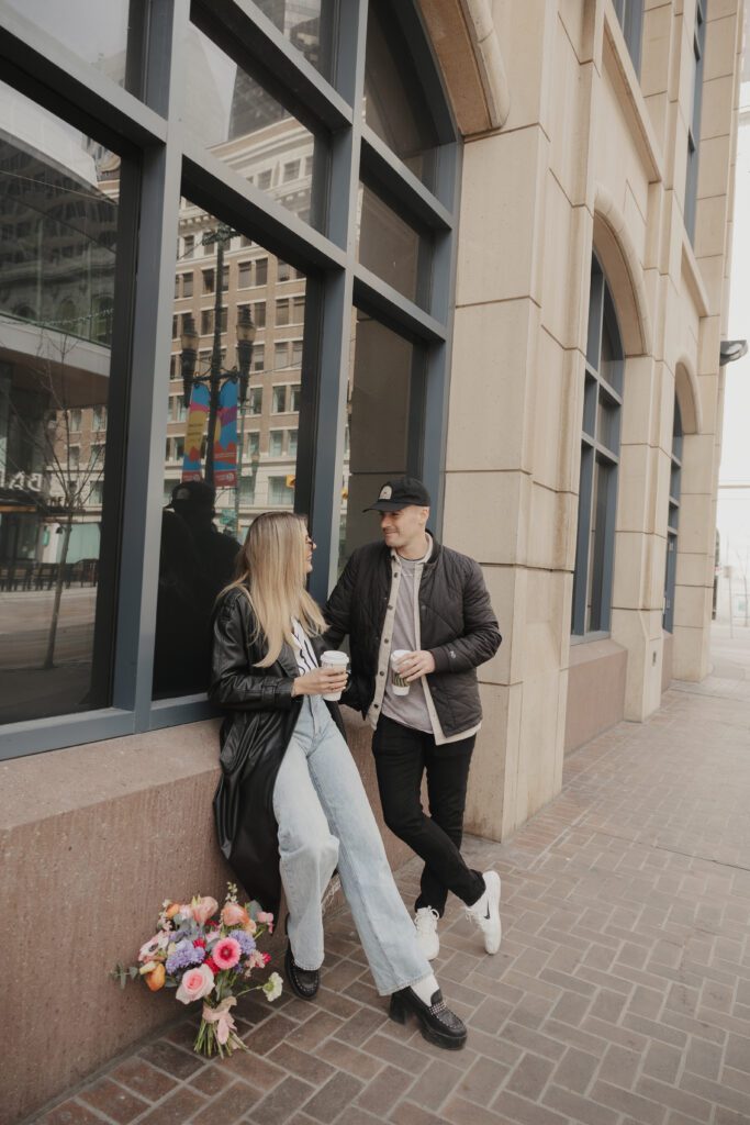 Couple exploring downtown Calgary during their modern edgy couples photoshoot 