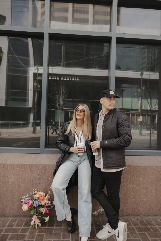 Couple exploring downtown Calgary during their modern edgy couples photoshoot 