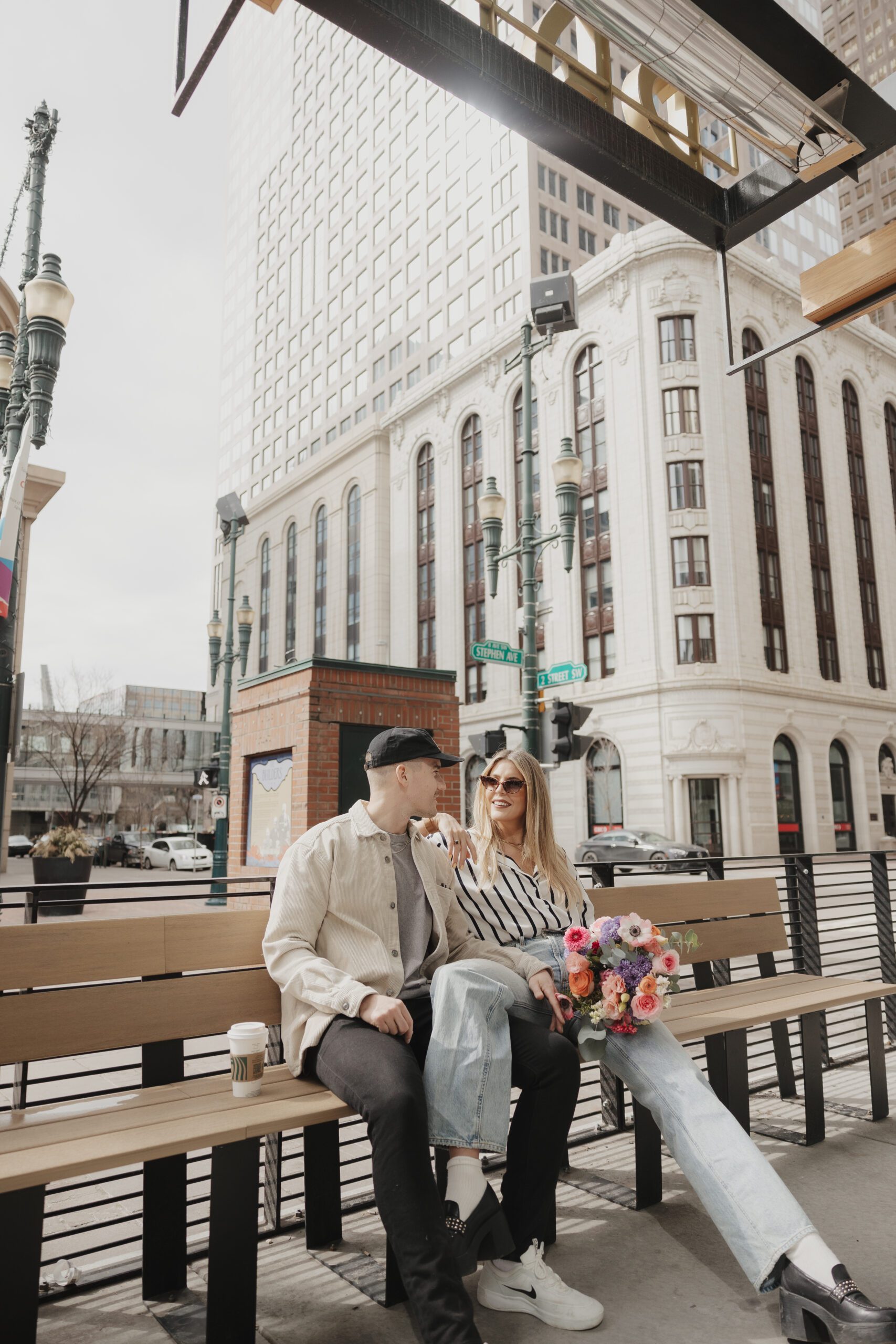 Couple exploring downtown Calgary during their modern edgy couples photoshoot 