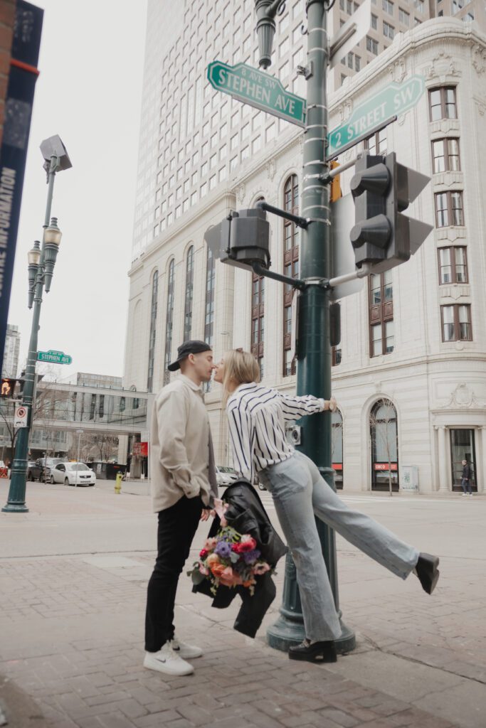 Couple exploring downtown Calgary during their modern edgy couples photoshoot 