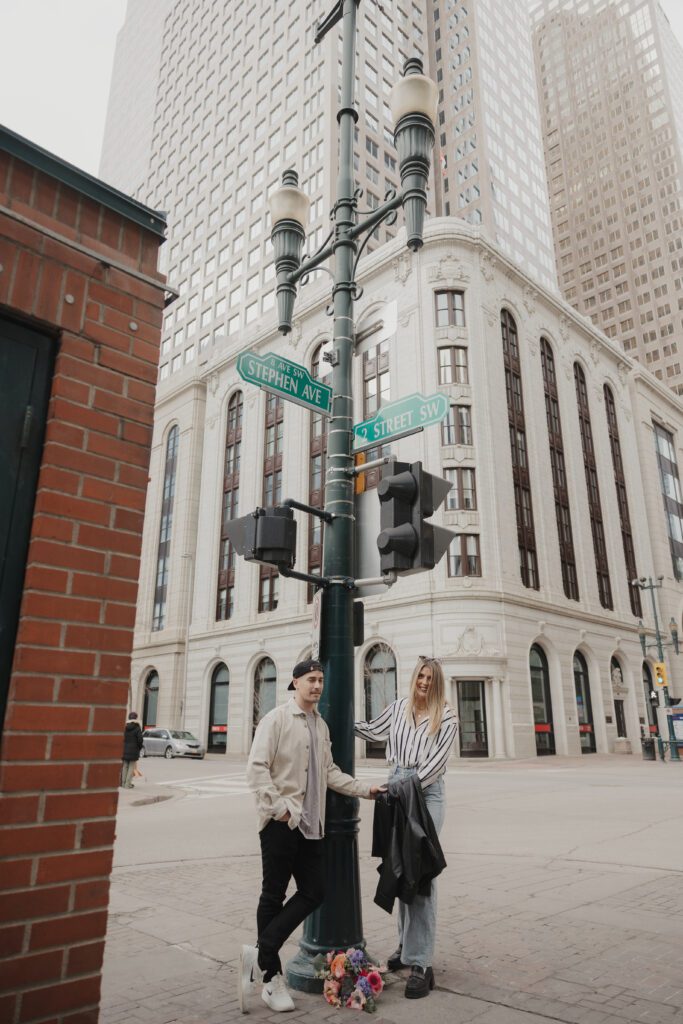 Couple exploring downtown Calgary during their modern edgy couples photoshoot 