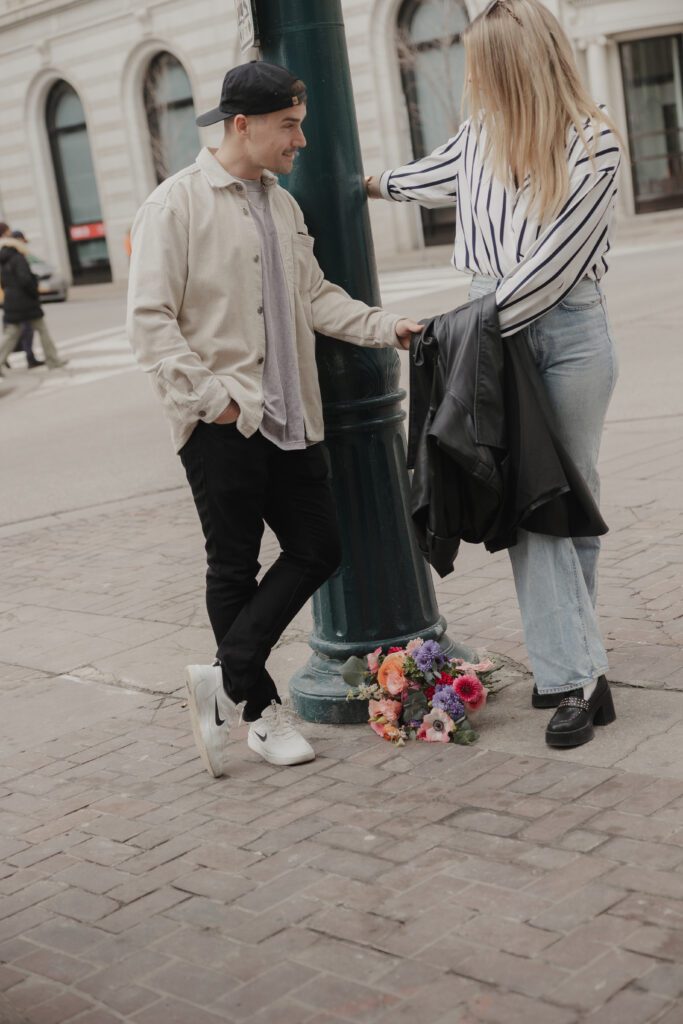 Couple exploring downtown Calgary during their modern edgy couples photoshoot 