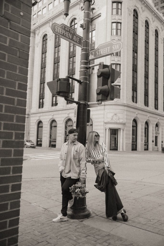 Couple exploring downtown Calgary during their modern edgy couples photoshoot 