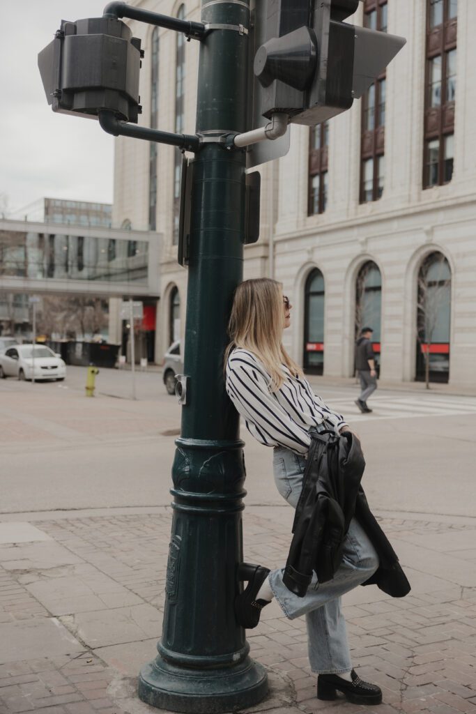 Couple exploring downtown Calgary during their modern edgy couples photoshoot 