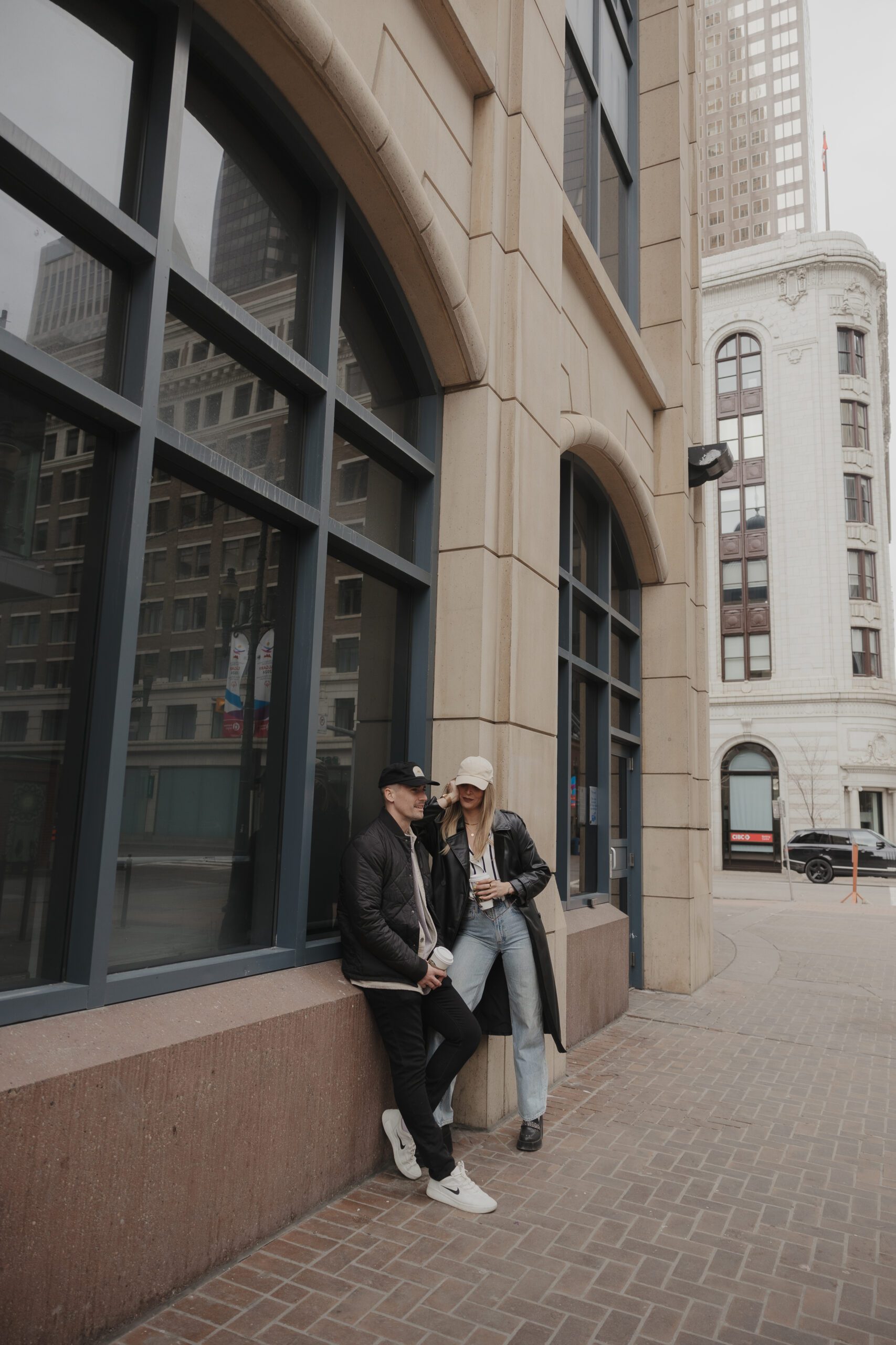 Couple exploring downtown Calgary during their modern edgy couples photoshoot 