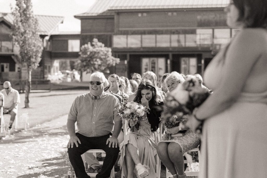 Bride's family getting emotional during their lakeside wedding ceremony in Candle Lake Saskatchewan