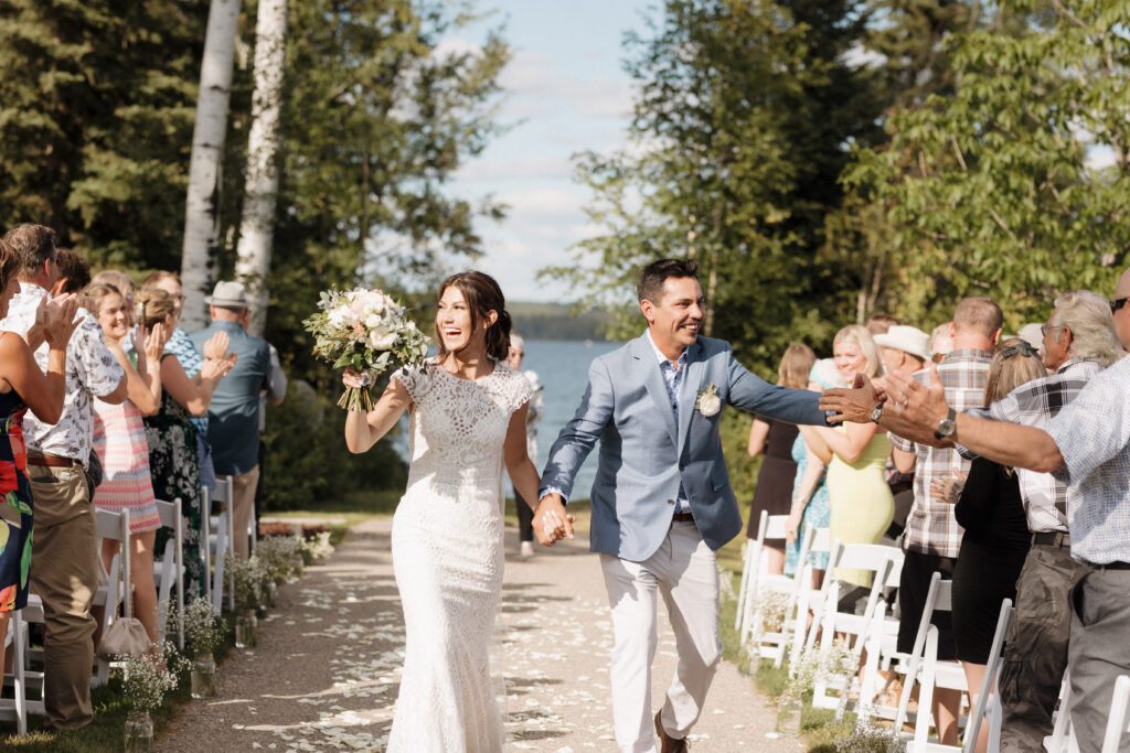 Bride and groom celebrating after their ceremony in Candle Lake Saskatchewan