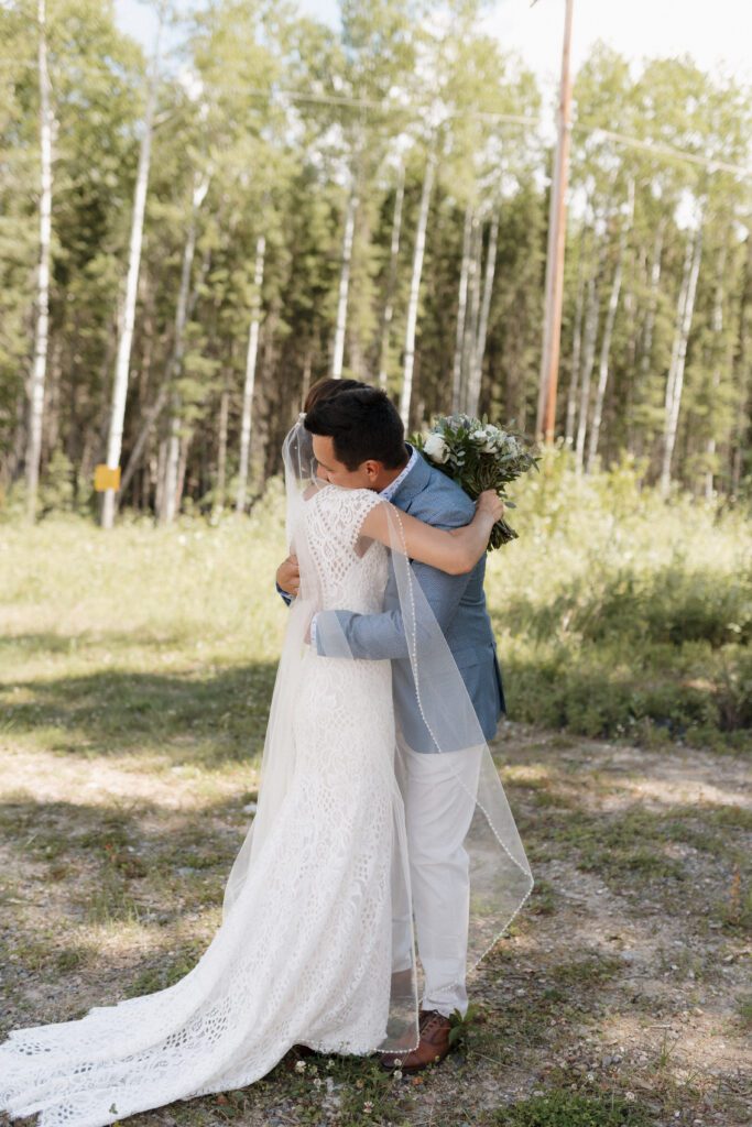 Bride and groom during their first look before their Candle Lake Wedding