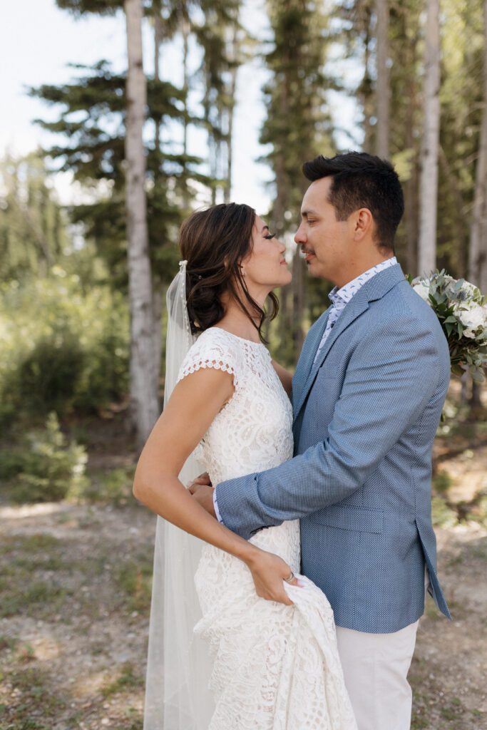 Bride and groom during their first look before their Candle Lake Wedding