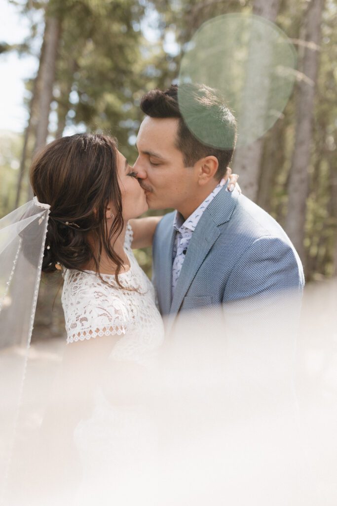 Bride and groom getting romantic on their wedding day