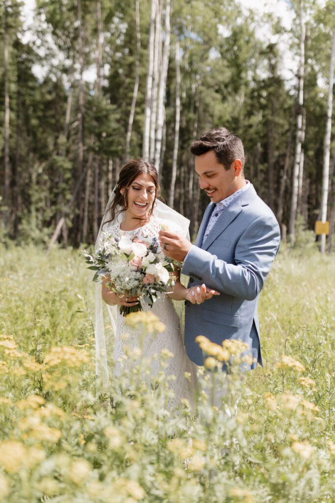 Bride and groom taking bridals in the forrest in Candle Lake Saskatchewan