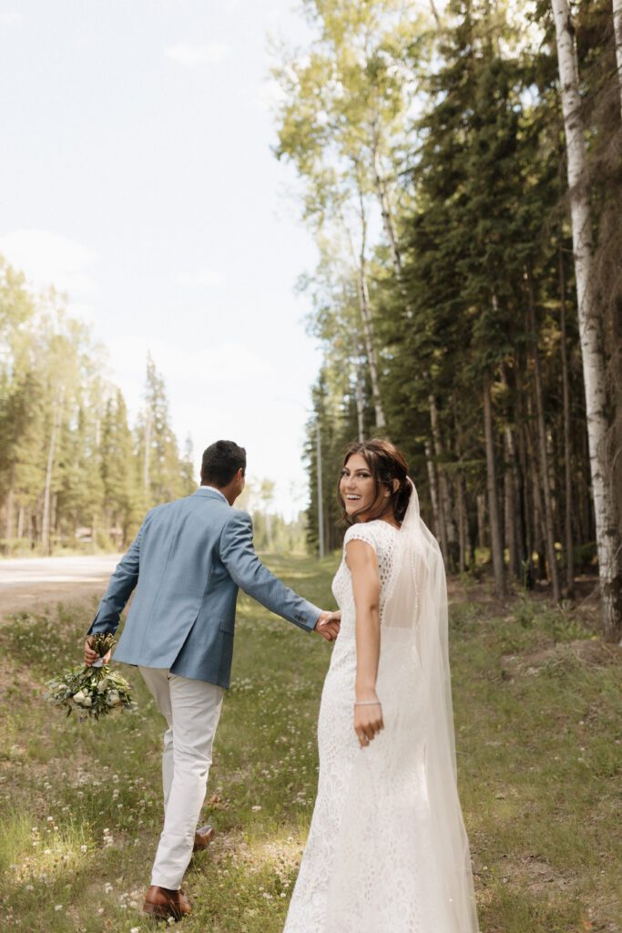 Bride and groom taking bridals in the forrest during their romantic woodland wedding day