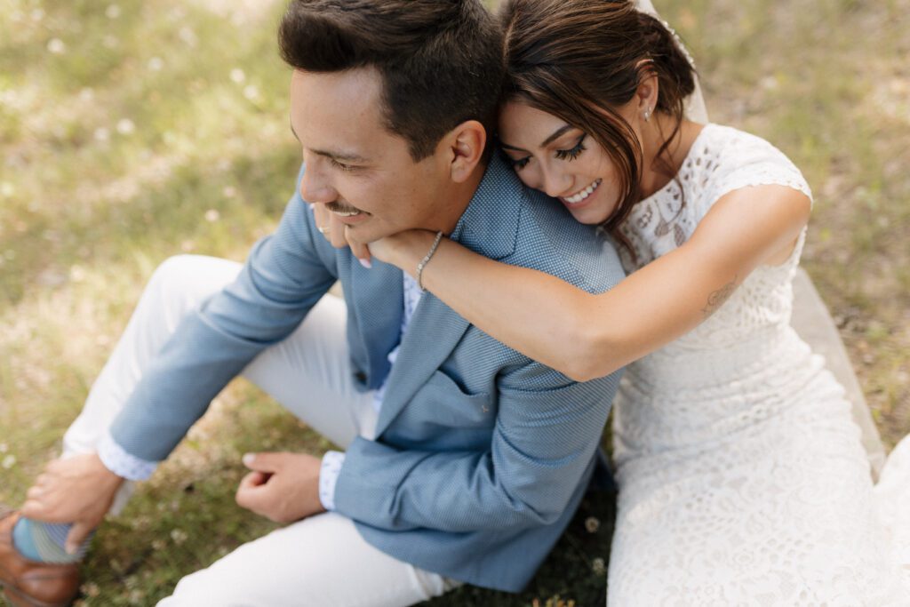 Bride and groom taking bridals in the forrest during their romantic woodland wedding day