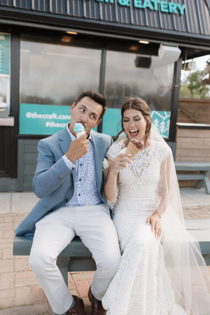 bride and groom celebrating their wedding with ice cream after their lakeside wedding ceremony