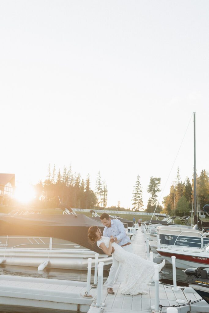 Bride and groom taking golden hour photos on the Candle Lake Golf course 