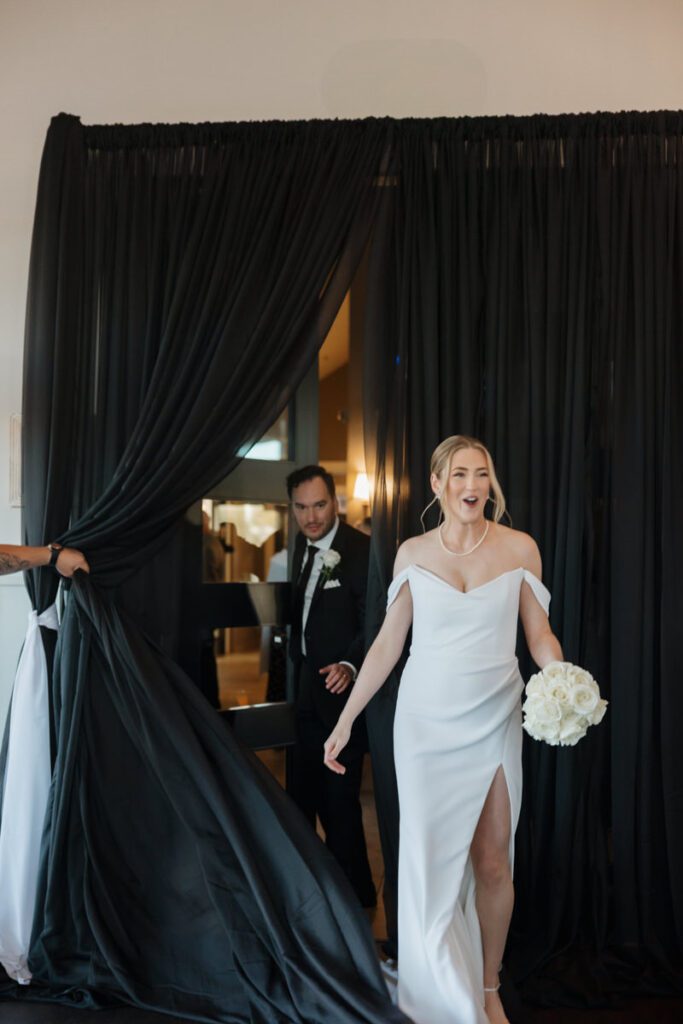 Elegant black-and-white reception decor at The Glen at Crossmount, featuring candles, florals, and romantic table settings