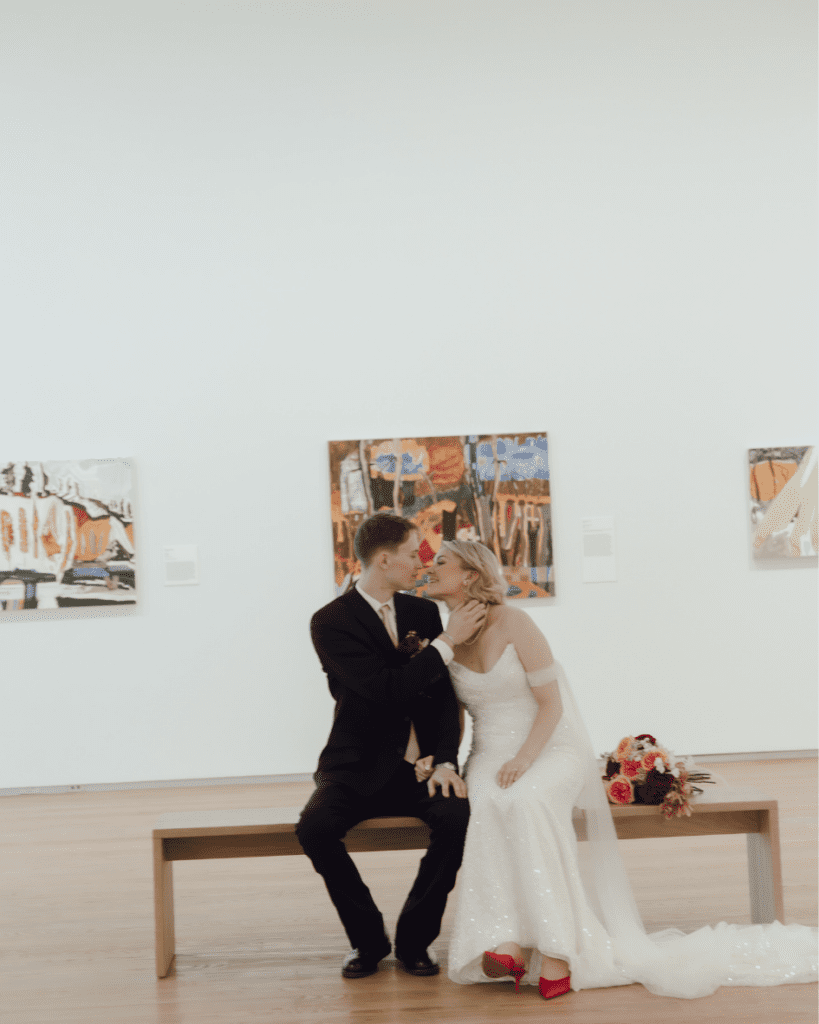 Bride and groom walking through the art installations during their wedding portraits