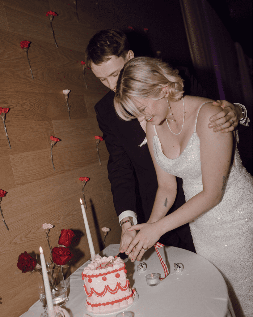 Bride and groom cutting their vintage heart cake