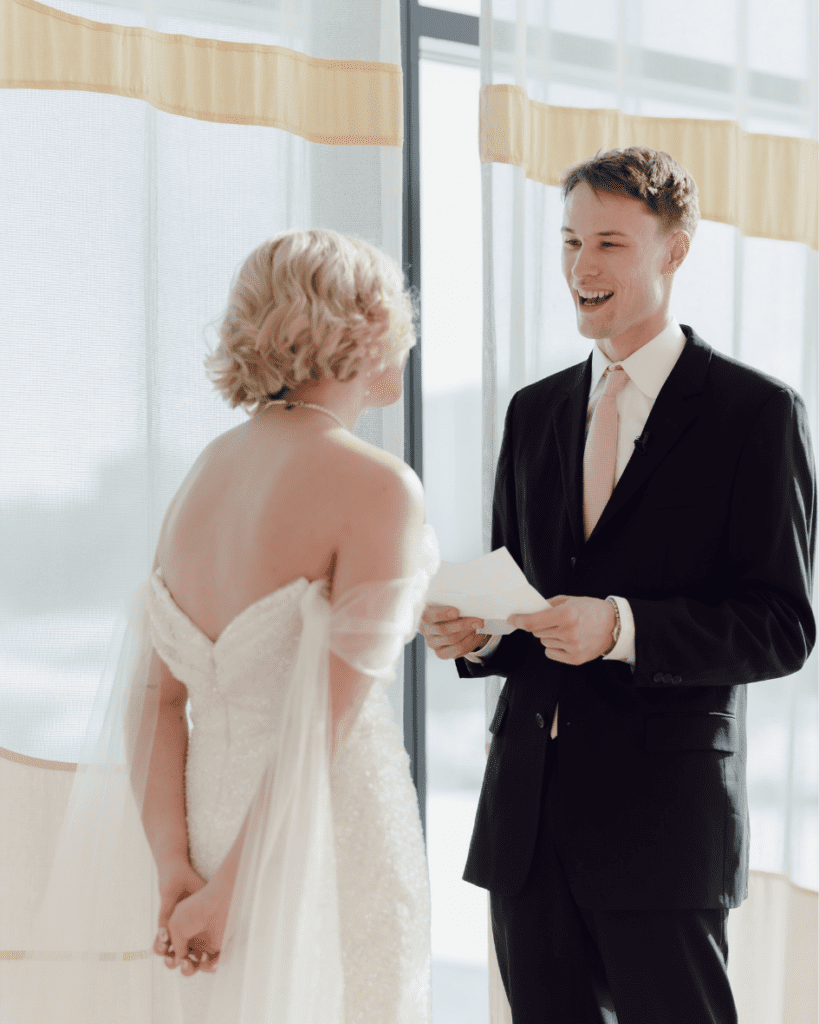 Bride and groom sharing a quiet moment among the art at Remai Modern during private vows