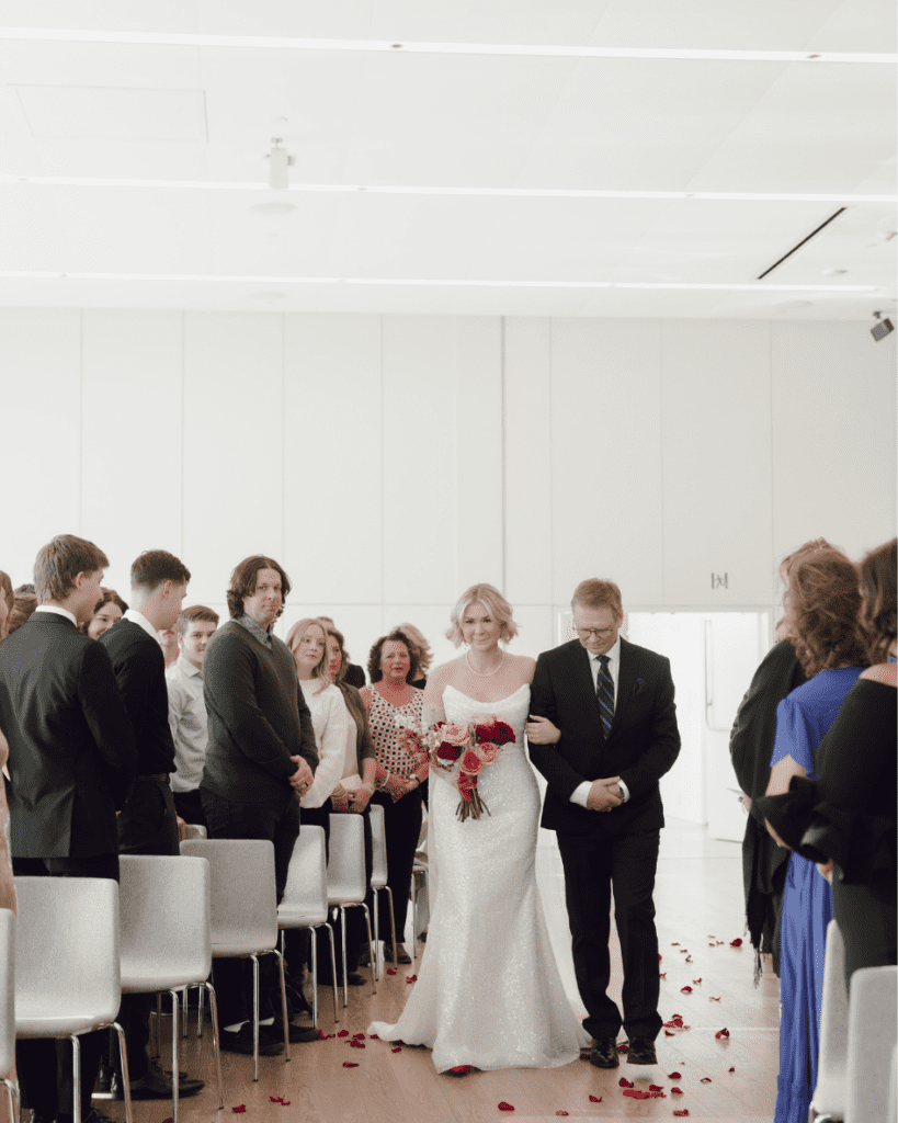 Brides dad walking her down the aisle