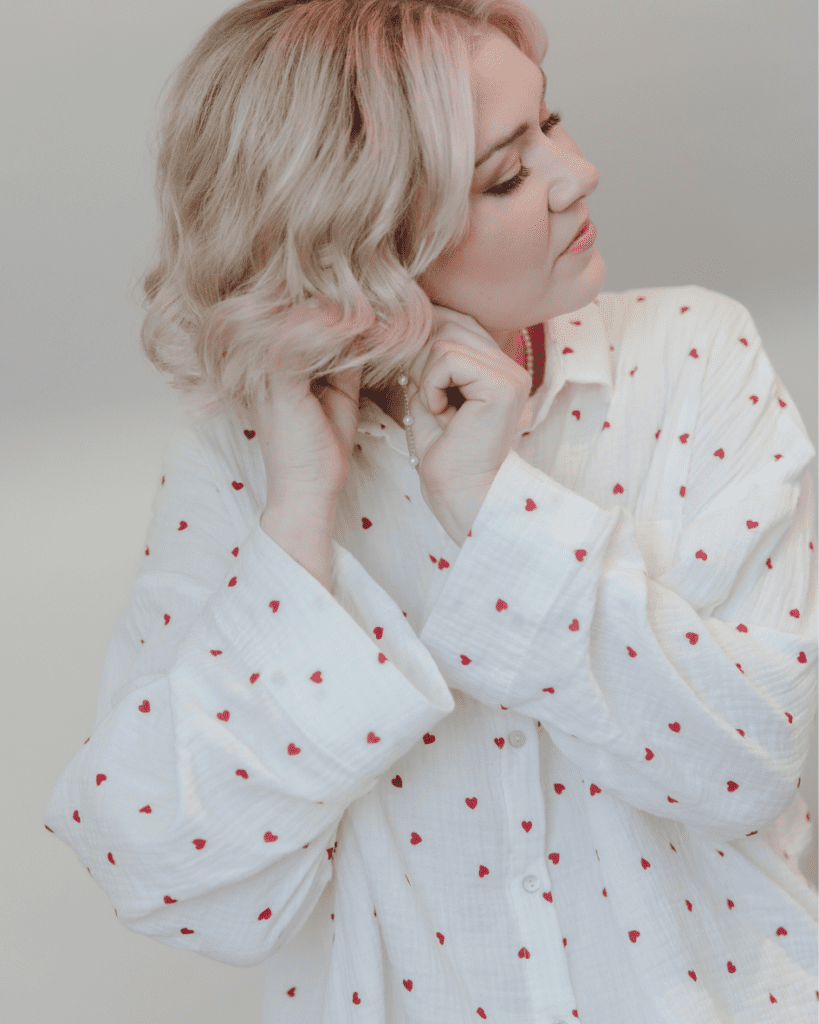 Bride getting ready with her bridesmaids in valentines themed pajamas