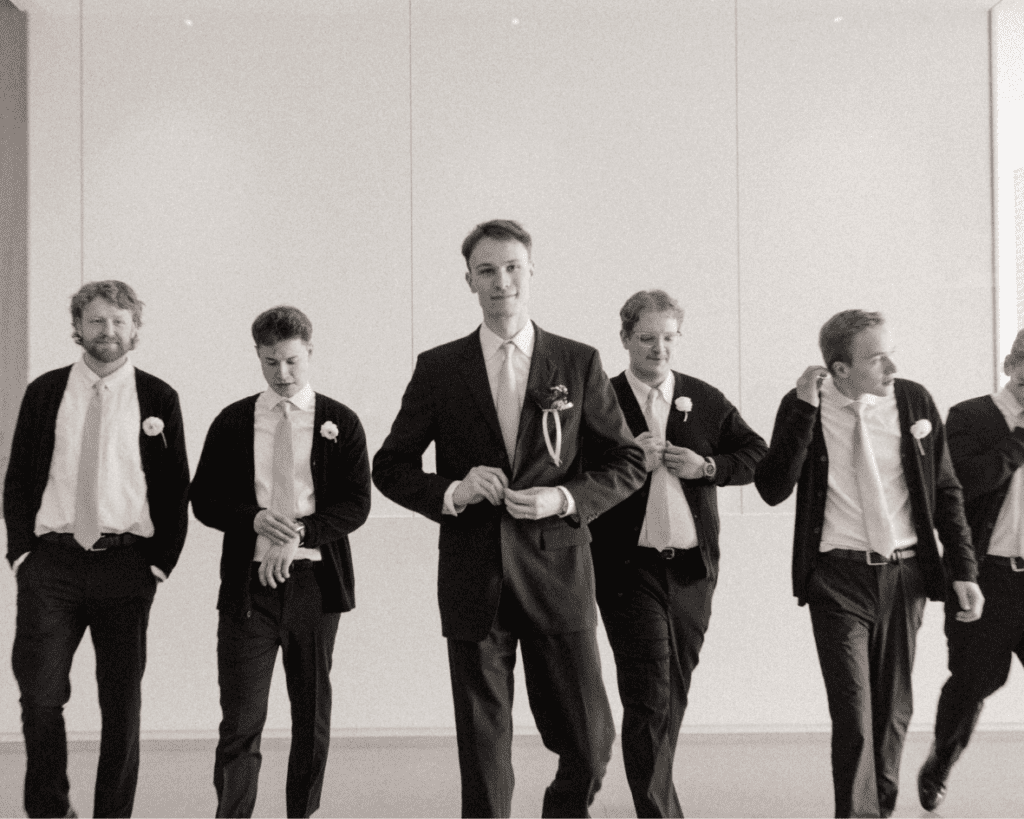 Groom and his groomsmen walking through the remai modern