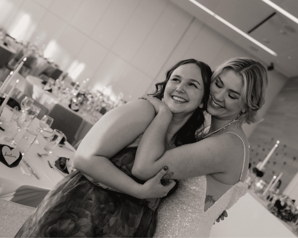 Bride and her bridesmaid celebrating