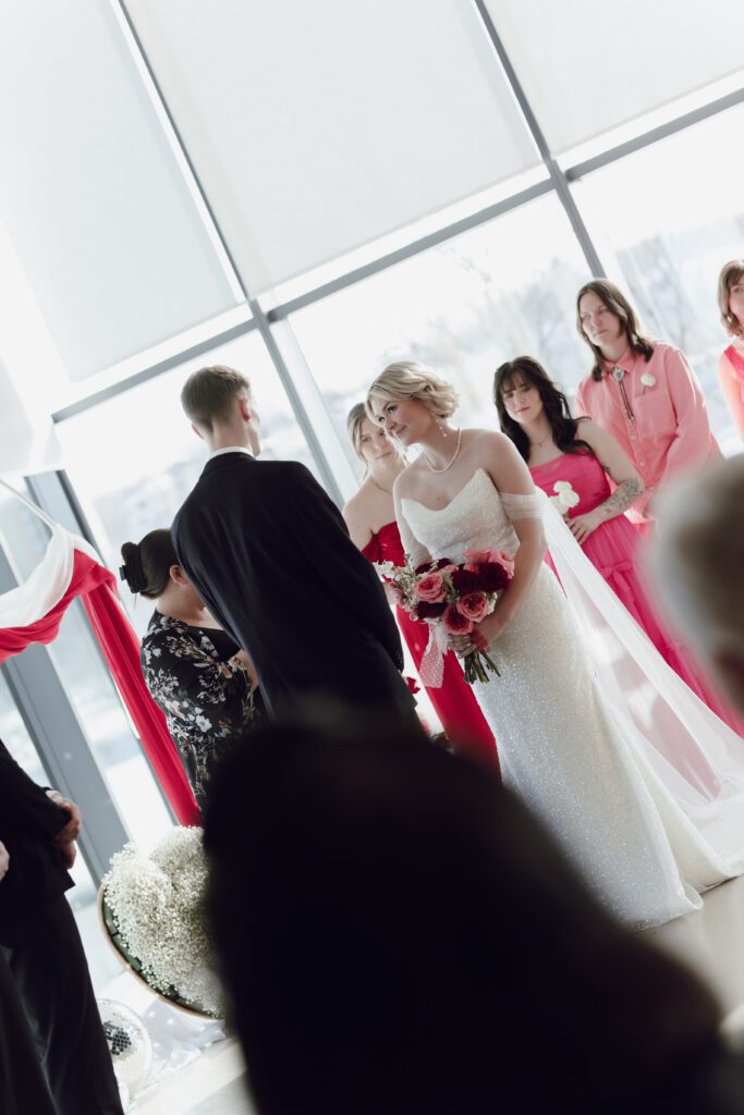 Contemporary wedding setup in the atrium at Remai Modern, Saskatoon, with modern art and panoramic river views