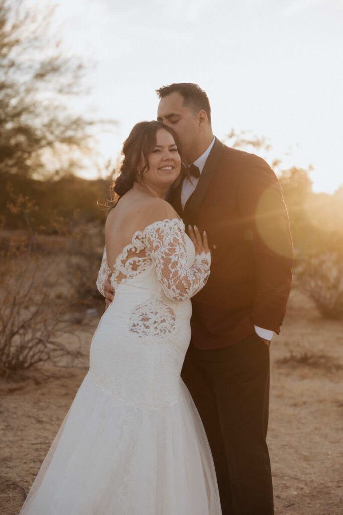 Golden hour portraits of newlyweds in Joshua Tree desert landscape