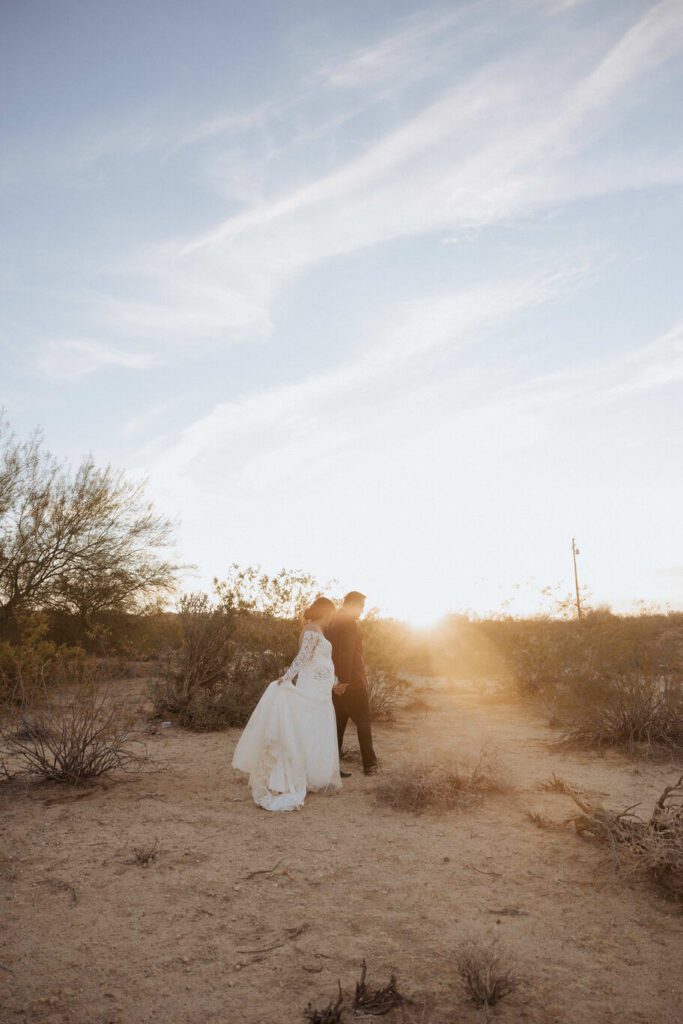 Golden hour portraits of newlyweds in Joshua Tree desert landscape