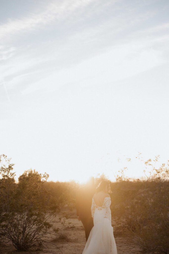 Golden hour portraits of newlyweds in Joshua Tree desert landscape