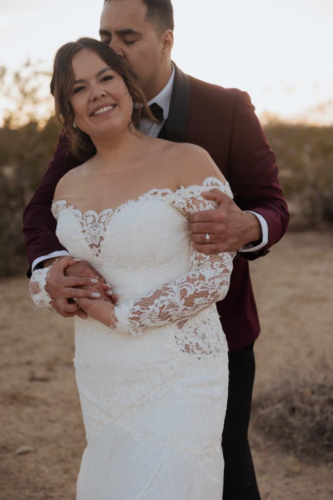 Golden hour portraits of newlyweds in Joshua Tree desert landscape