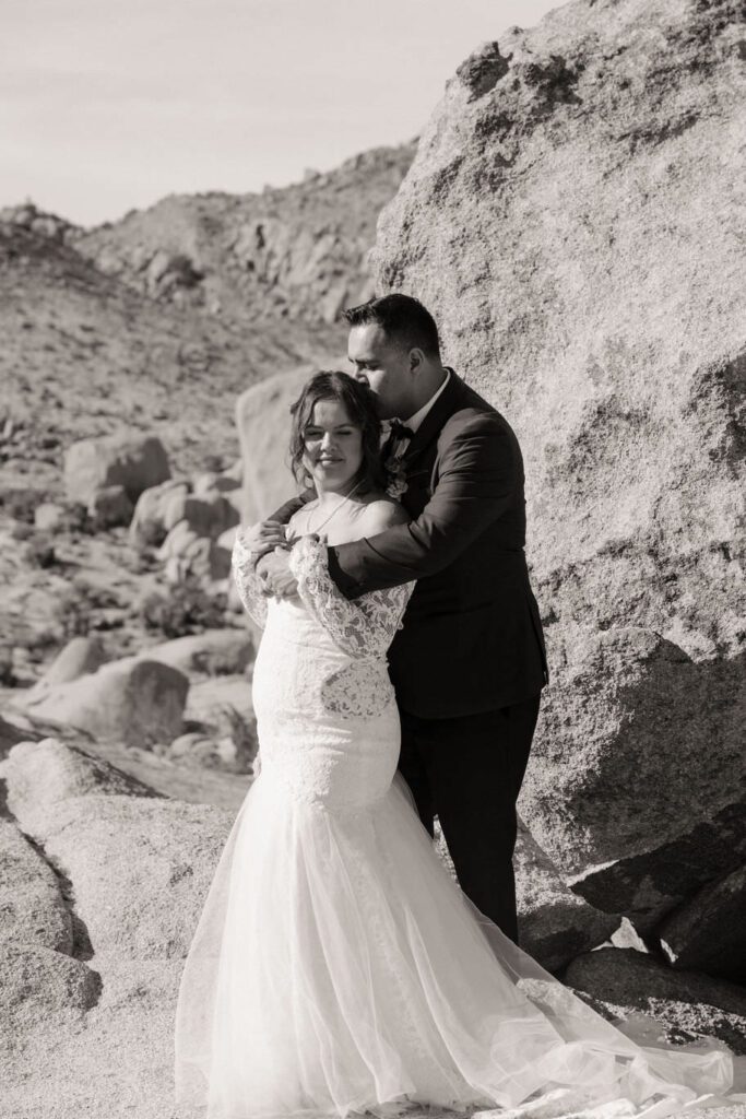 Golden hour portraits of newlyweds in Joshua Tree desert landscape
