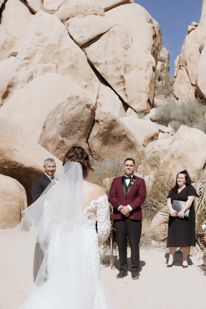 Intimate desert ceremony at Split Rock in Joshua Tree National Park with close family present