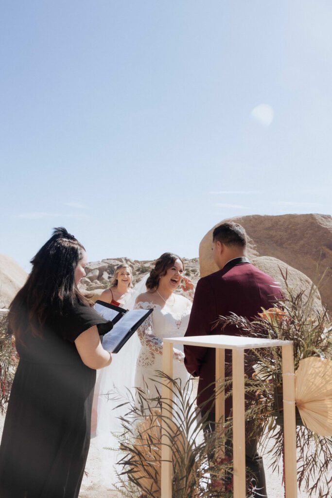 Intimate desert ceremony at Split Rock in Joshua Tree National Park with close family present