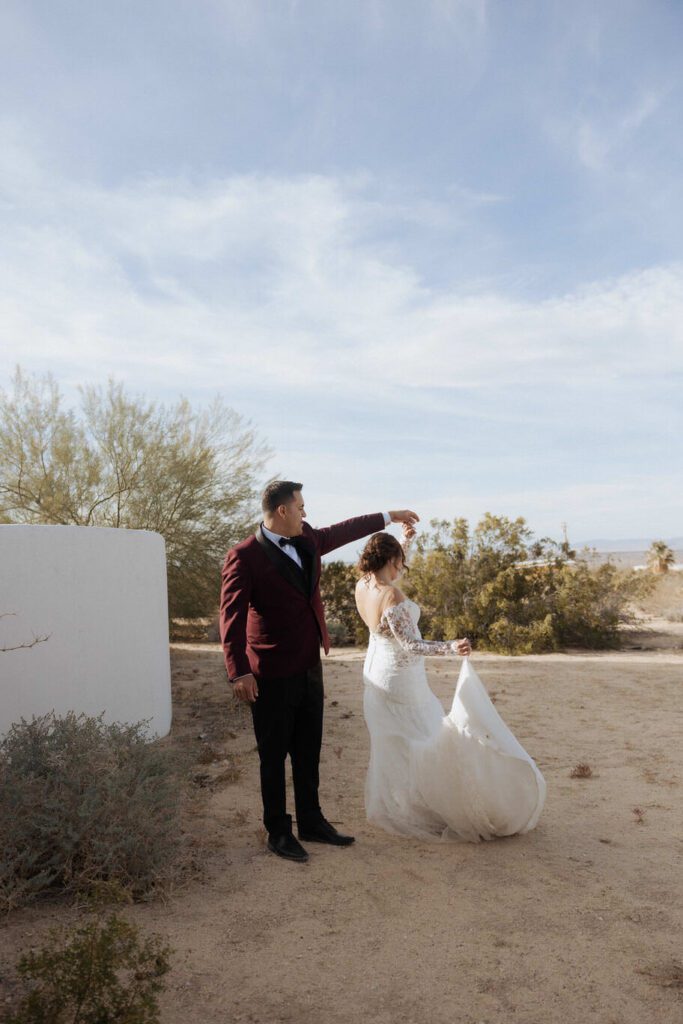 Candid moment of couple embracing with warm golden light during Joshua Tree elopement