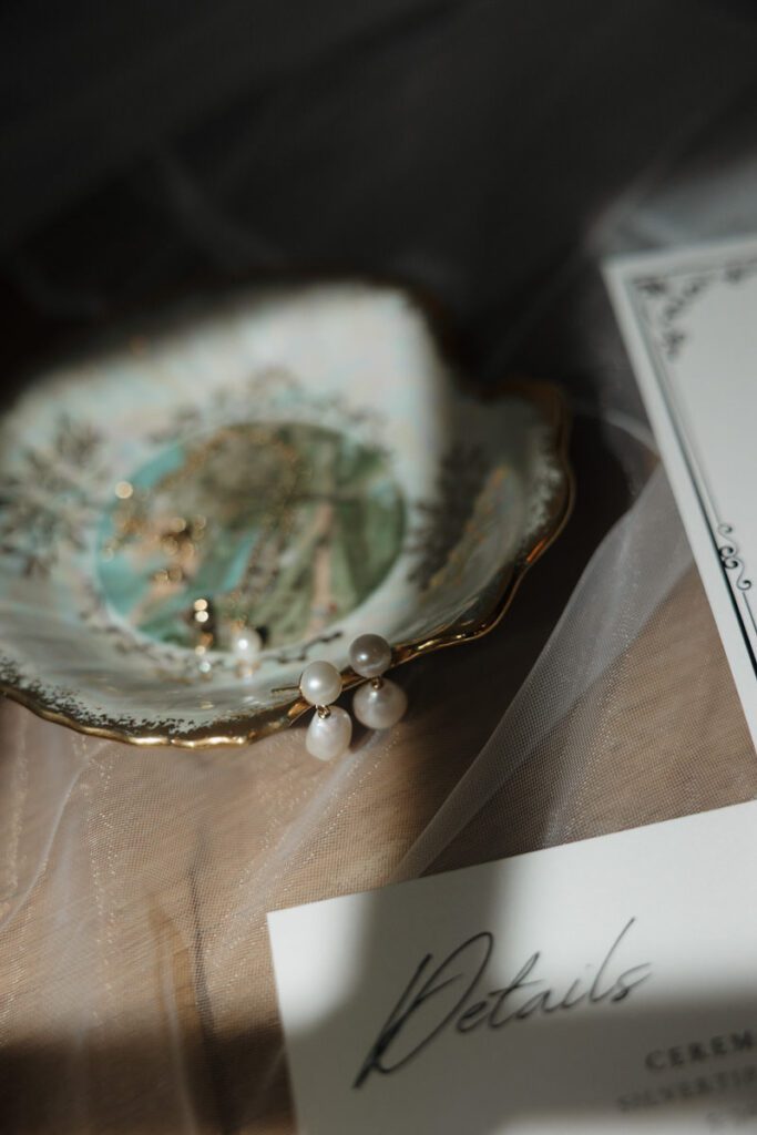 brides detail shots in a moody flat lay