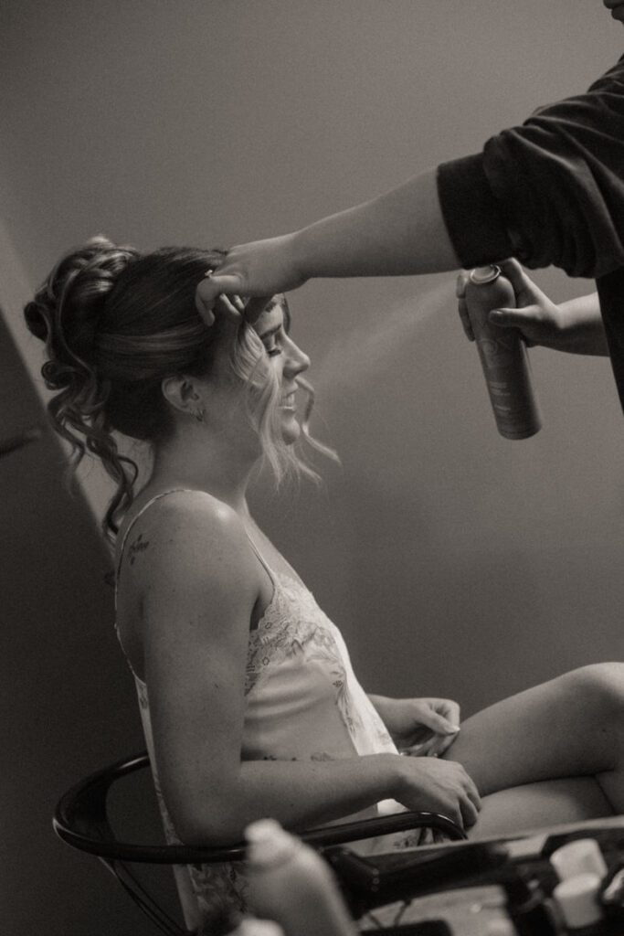 Bride getting ready with Bellamore Beauty styling her hair