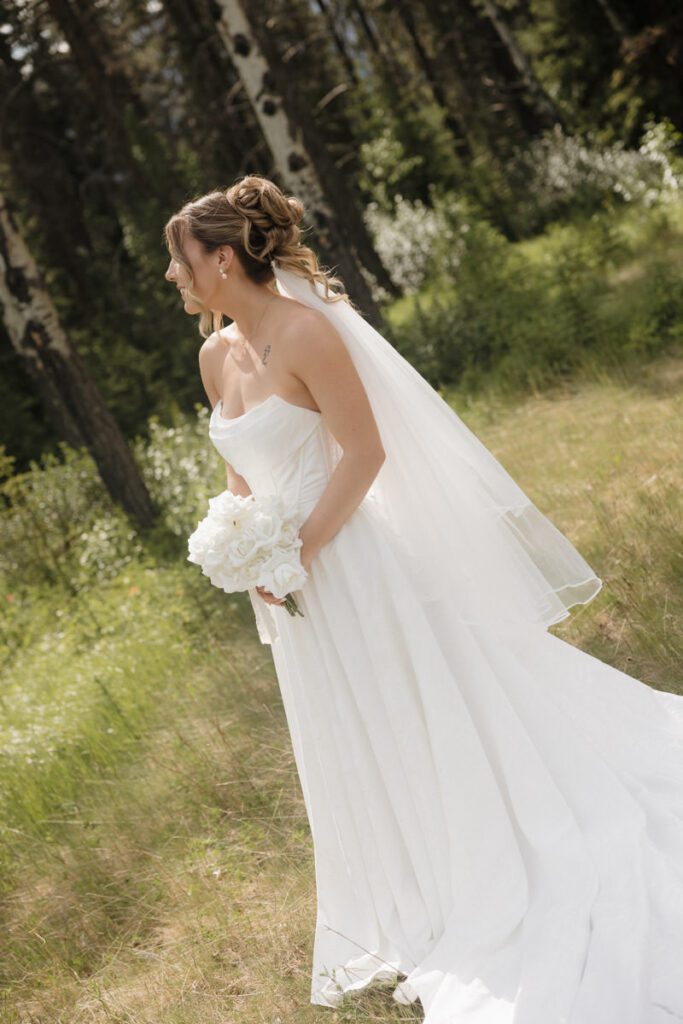 Bride holding bouquet at Silvertip Golf Course wedding venue
