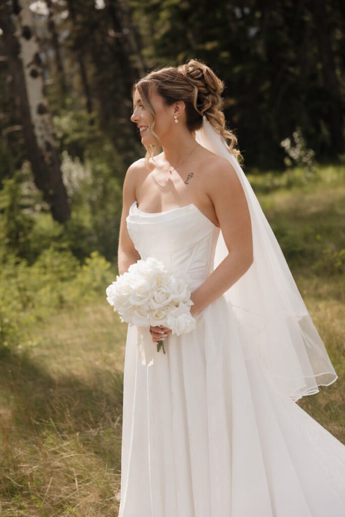 Bride holding bouquet at Silvertip Golf Course wedding venue