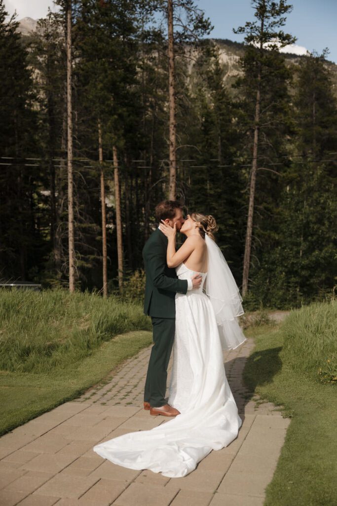 Mountain view wedding portraits with bride and groom smiling