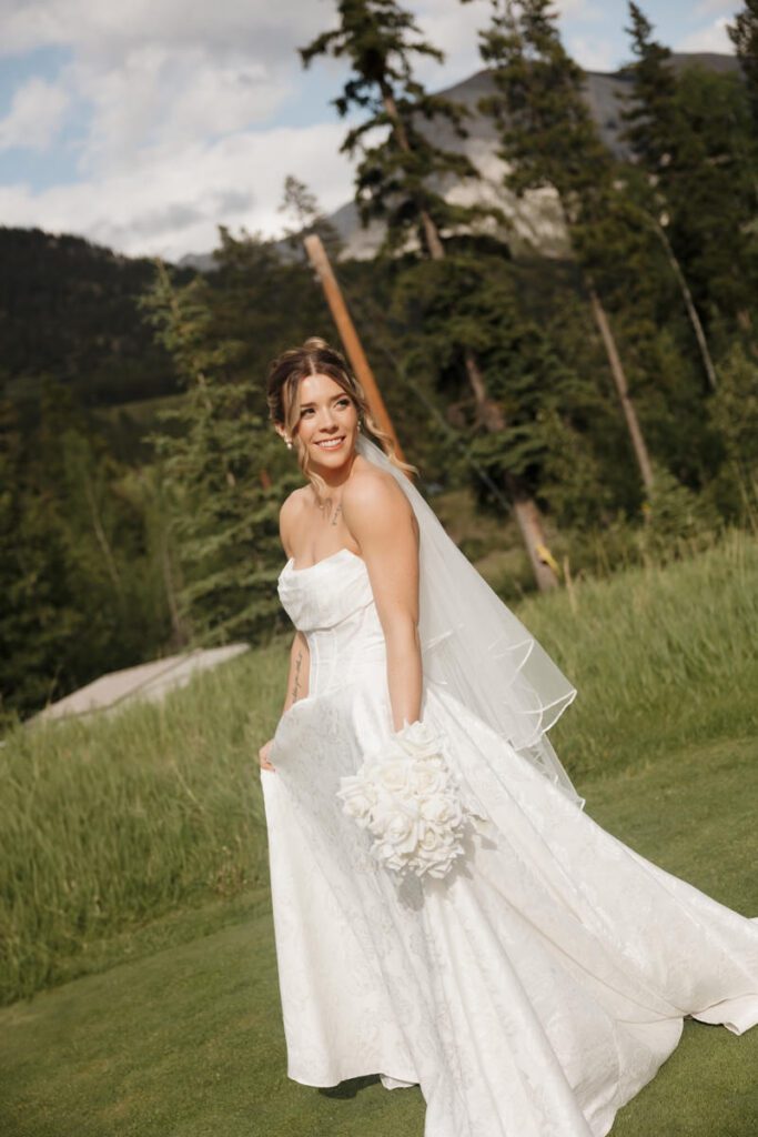 Bride holding bouquet at Silvertip Golf Course wedding venue