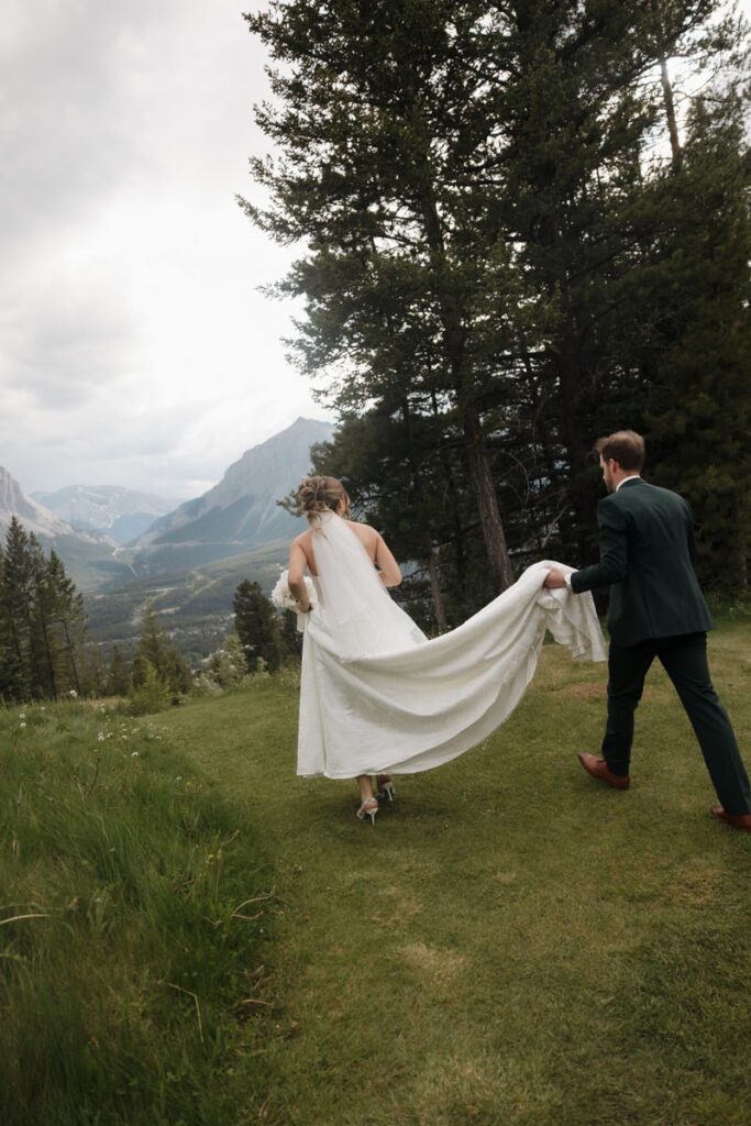 Mountain view wedding portraits with bride and groom smiling