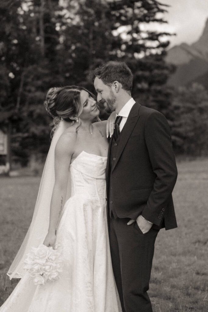 Mountain view wedding portraits with bride and groom smiling