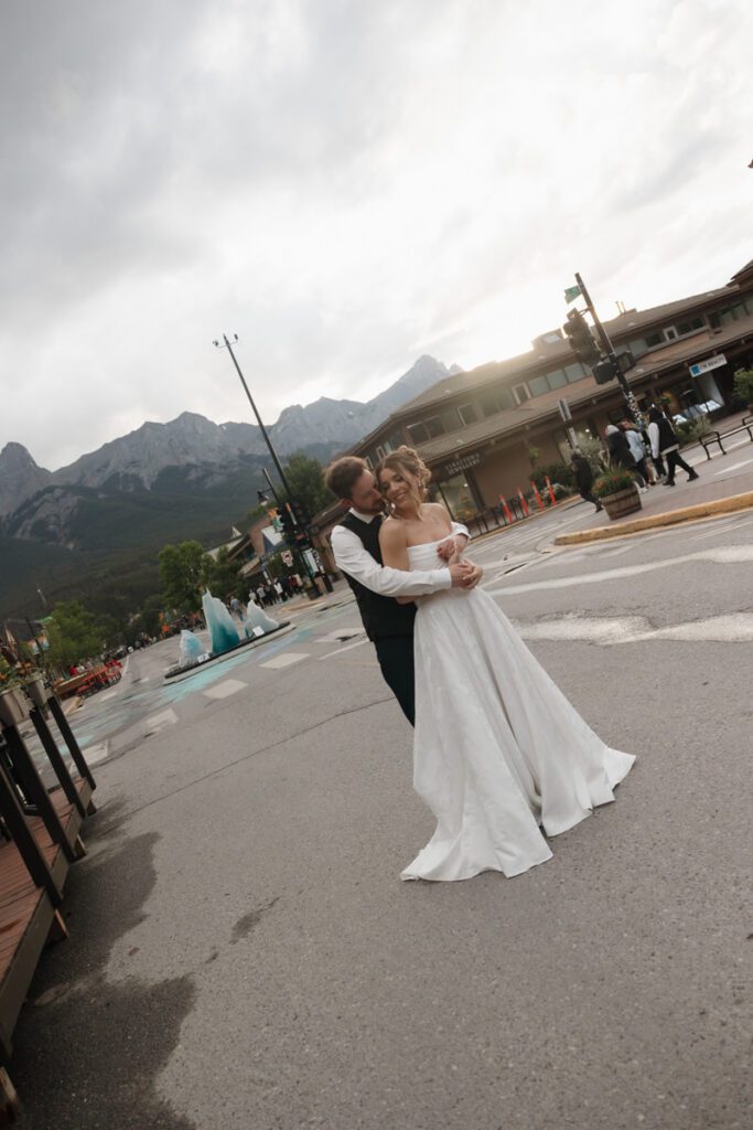 Couple embracing during golden hour in downtown canmore