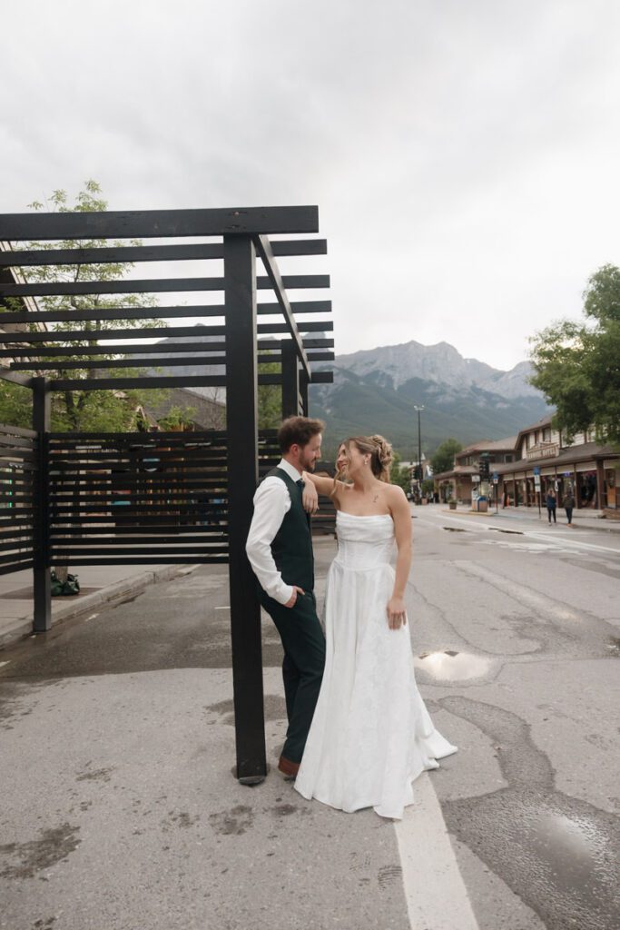 Couple embracing during golden hour in downtown canmore