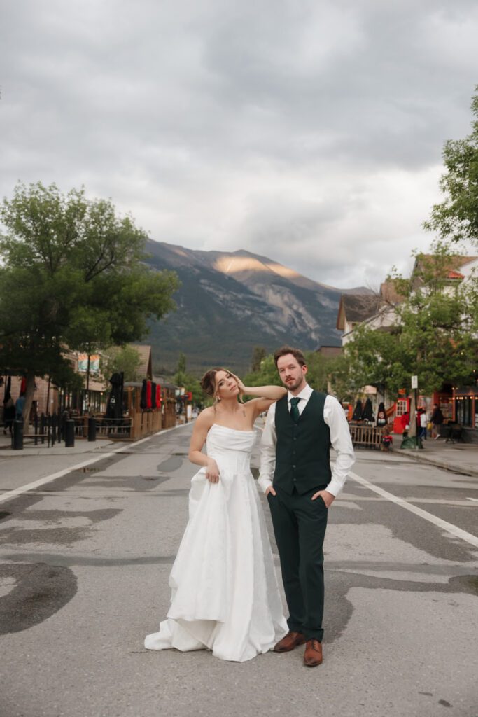 Couple embracing during golden hour in downtown canmore wedding venue